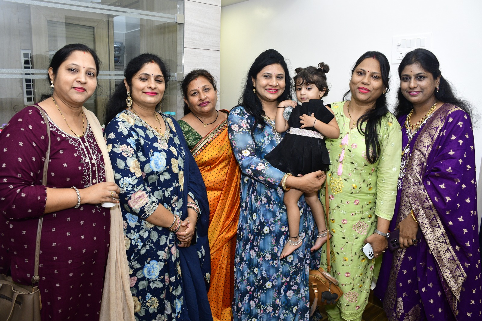 Women guests visiting Tirumauli Developers office during a company event